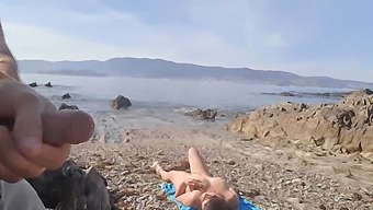 A Daring Man Displays His Genitals To A Nudist Mature Woman Who Proceeds To Perform Oral Sex On Him At The Beach.